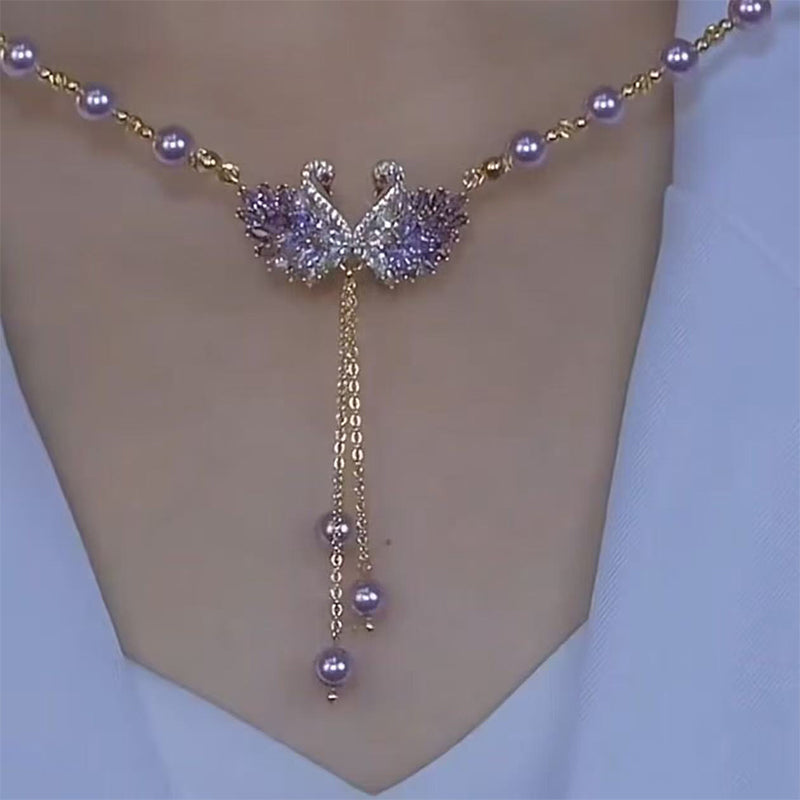 Collar doble de cisnes con colgante en color morado.-ES